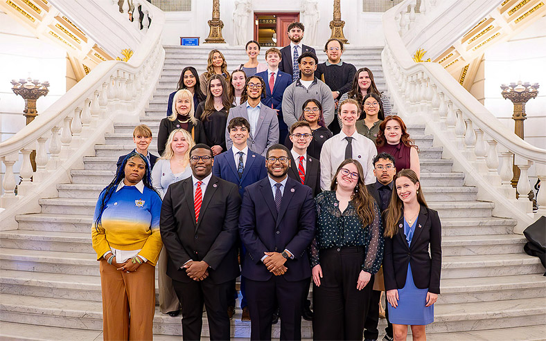 West Chester University Student Government Association members pose on the Rotunda steps at the state Capitol.