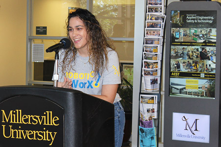 Hecmarys Cintron speaks about robotics at an event in Millersville University.